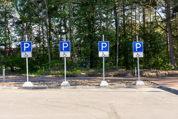 Parking signs for people with disabilities in the park