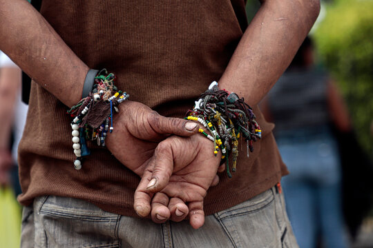 Mexico City, Mexico, July 28, 2021. Details of the hands of a devotee in the church of San Judas Tadeo, San Hip&oacute;lito, located in the Guerrero neighborhood of downtown Mexico City.