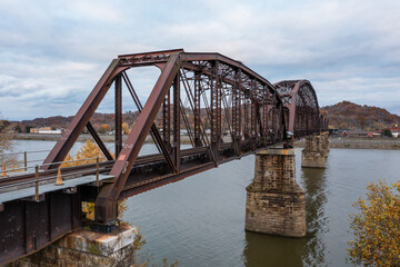 Fototapeta premium Cloudy Day View of Kanawha River Railroad and Norfolk Southern Railroad Through Truss Bridge - Pt. Pleasant, West Virginia and Gallipolis, OHio
