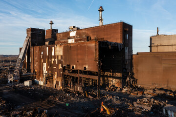 Obraz na płótnie Canvas Aerial of Rusted and Basic Oxygen Furnace and Caster Undergoing Demolition at Sunset - Abandoned Armco Steel / AK Steel Ashland Works - Russell and Ashland, Kentucky