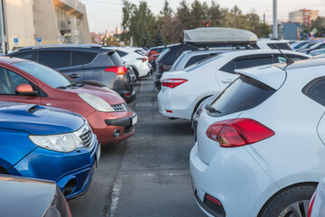 Fototapeta premium Cars are parked on a city street