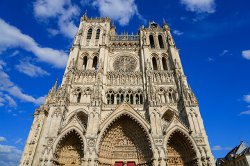Facade of the Cathedral Basilica of Our Lady of Amiens in Picardy. This is the largest cathedral in France by its interior volumes - This gothic style building is listed as a World Heritage Site