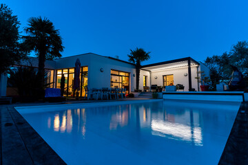 night shot of a modern house with pergola bioclimatic - obrazy, fototapety, plakaty