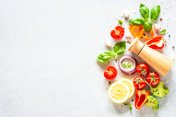Fresh vegetables and herbs on white background. Top view with copy space.