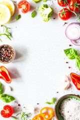 Food frame with Fresh vegetables, herbs and spices on white background. Top view with copy space.