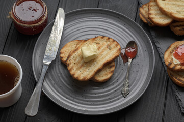 Continental Breakfast meal served with coffee, toast, jam and butter. Delicious coffee table.