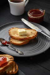 Continental Breakfast meal served with coffee, toast, jam and butter. Delicious coffee table.
