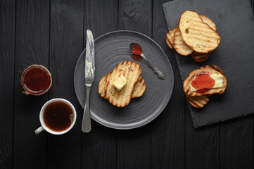 Continental Breakfast meal served with coffee, toast, jam and butter. Delicious coffee table.