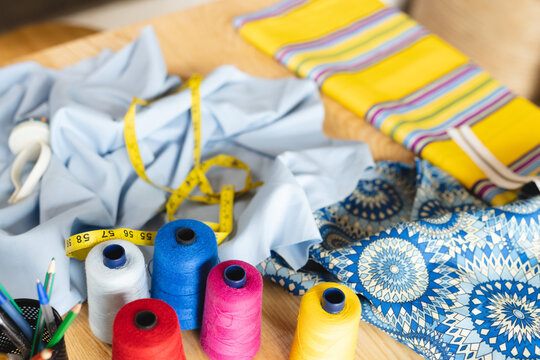 Image of colorful threads and materials in sewing workshop