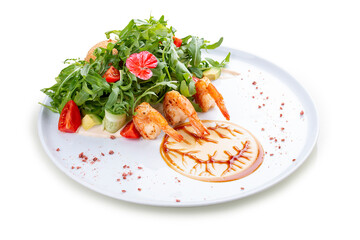 Salad with shrimp, arugula and crispy egg with oyster sauce. On a white background, isolated.