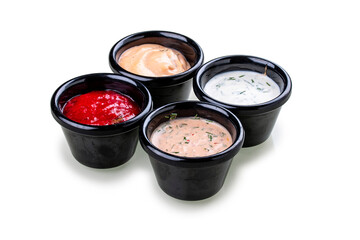 Set of four different sauces. On white background, isolated.