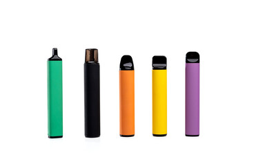 Set of colorful disposable electronic cigarettes of different shapes on a white background. modern smoking.