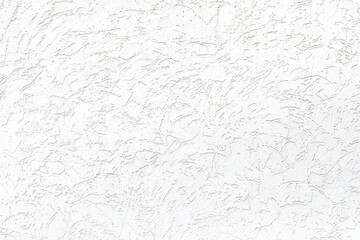 Fototapeta premium White plastered wall. Imitation of the bark beetle surface. Plastered wall using a granular decorative mixture