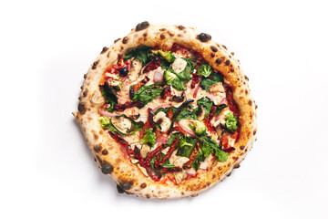 Top view of pizza topped with sun dried tomatos, mushrooms, red onion and braccoli on a white background