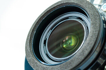 Close up beautiful camera lens with color reflection background.