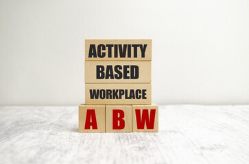 activity based workplace words on wooden block