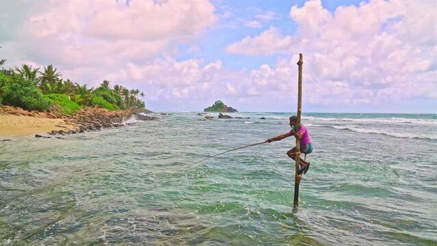 Stilt fisherman near the coastline of Sri Lanka fishing