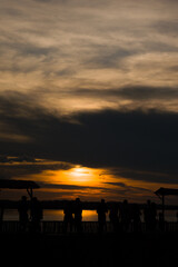 Fototapeta na wymiar People at sunset over the amazon river