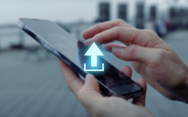 illustrated glowing upload arrow icon in front of fingers touching on the display of a smartphone, file sharing, transmitting data, internet, network, connection, sharing