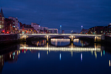Fototapeta na wymiar Beautiful of River Lee and Saint Patrick's Bridge in the evening. Cork City, Ireland