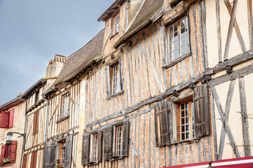 Facade of half timbered houses, medieval buildings, in a typical french medieval village and city, bergerac, in France, in Dordogne and Perigord, with a typical of the Southwestern French architecture