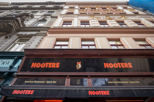PRAGUE, CZECHIA - NOVEMBER 3, 2019: Hooters logo in front of their restaurant for Prague. Hooters is an American multinational chain of casual dining restaurants