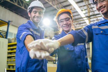 Fototapeta na wymiar Group of young industrial people worker work in factory with happiness