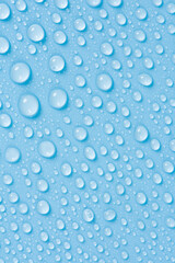 close up of water drops on blue background.