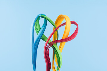 Colorful paper striped  in curls and twisted background.Color spectrum banner.