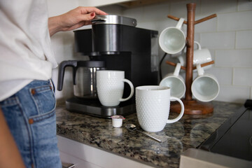 Fototapeta na wymiar Brewing coffee into a white cup