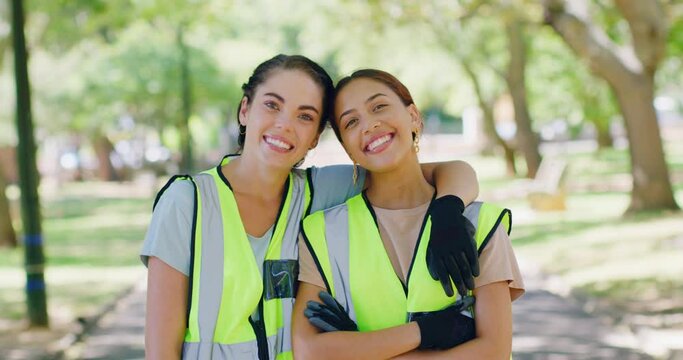 Portrait of two young community workers uniting for a cleanup service or project outdoors. Young happy volunteers smiling while collecting trash in a park, doing their part to protect the environment