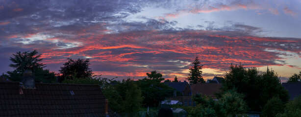 scenic sunset panorama over houses and gardens in Brake Unterweser, Germany