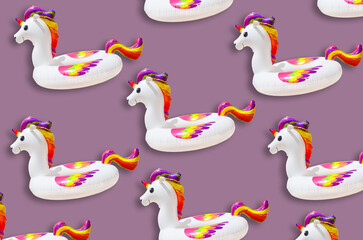 inflatable circle or ring for kids rainbow unicorn for floating in summer vacation isolated on colored background, inflatable toy for child for relaxation on water