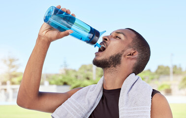Fit, active, sporty man taking a break from practice to hydrate and refresh. Hydrating during...