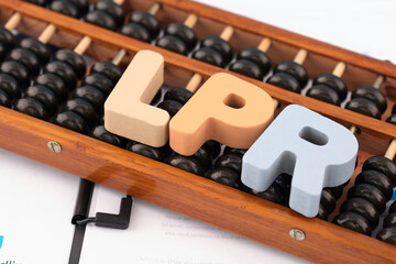 Chinese traditional abacus and English abbreviation LPR