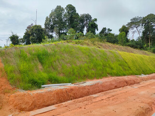 Permanent slope protection with grass using the hydroseed method. The grass is used to stabilize...