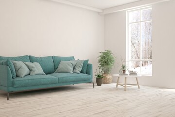 Fototapeta premium White living room with sofa and winter landscape in window. Scandinavian interior design. 3D illustration