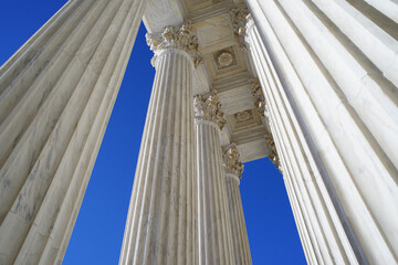 Columns at the entrance of the Supreme court in Washington DC, USA on blue sky