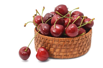 Sweet cherry in basket new harvest isolated on white