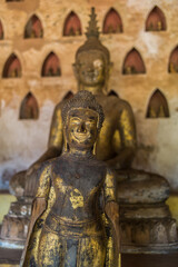 Fototapeta premium Bronze Buddha statues at Haw Phra Kaew. It's a former temple in Vientiane, Lao. The interior now houses of museum and a small shop 