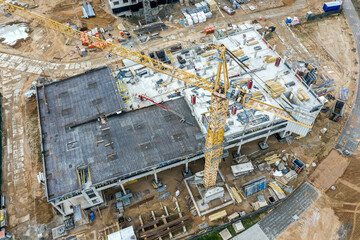 construction of multilevel parking garage. modern city infrastructure. aerial view with drone.