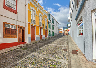 Colorful buildings in the streets of Santa Cruz de La Palma. Houses or homes built in a vintage architecture design in a small town or village. The bright and vibrant city for vacations or holidays