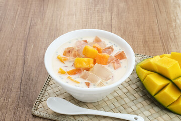 Mango Cheese Milk, a dessert made from jelly, nata de coco, basil seed, sweet mango, cream cheese and milk.

