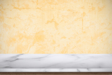 Fototapeta na wymiar White marble table with old concrete textured wall background.