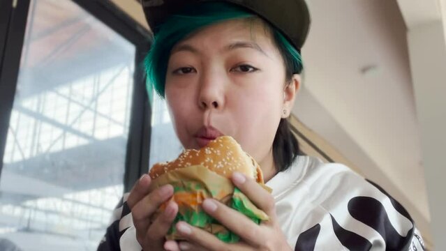 Asian Girl Biting Eating Plant Based Whopper Vegan Burger