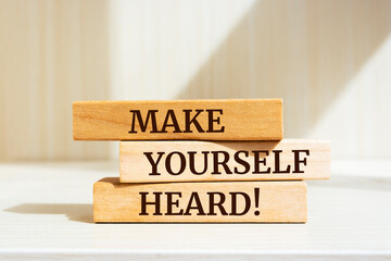 Wooden blocks with words 'Make Yourself Heard'.