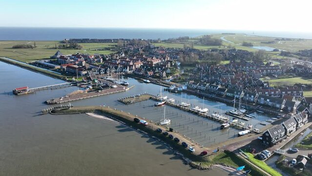 Peninsula Marken in the municipality of Waterland harbour. Old dutch historic fishing village in the Markermeer. European dutch culture, old wooden houses. Touristic attraction.