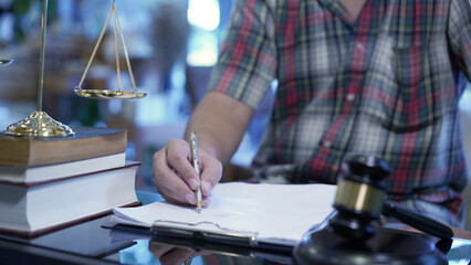 Lawyer or judge's hammer in the court. Auction's hammer is on woo table. Law subject or auction...