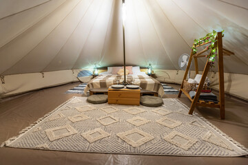 Fototapeta na wymiar Tent interior at glamping, night