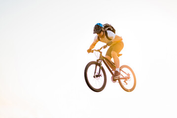 Mountain bike cyclist riding a bicycle isolated against the white background. 
